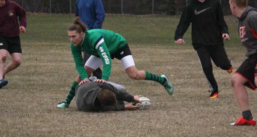 Students from Mounds View, Irondale, and other high schools in the area hold rugby practice at the Island Lake field.