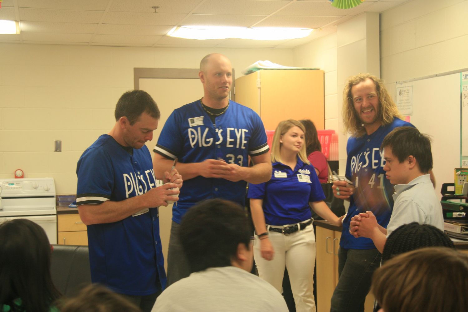 Saints players and mascot visit special education class.