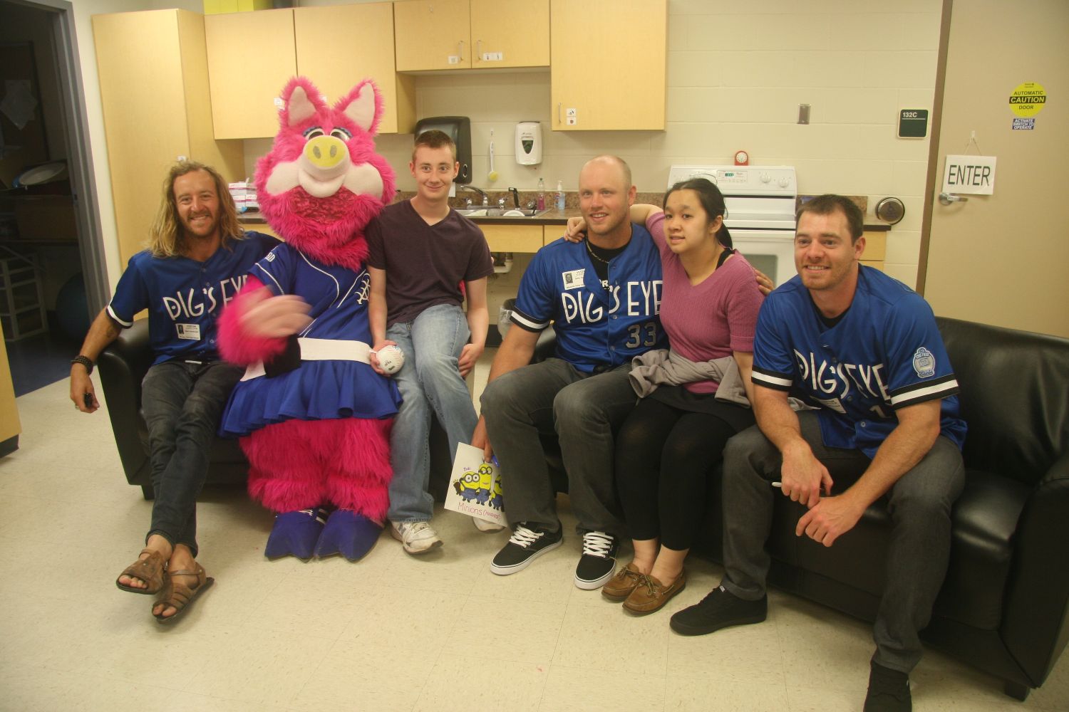 Saints players and mascot visit special education class.