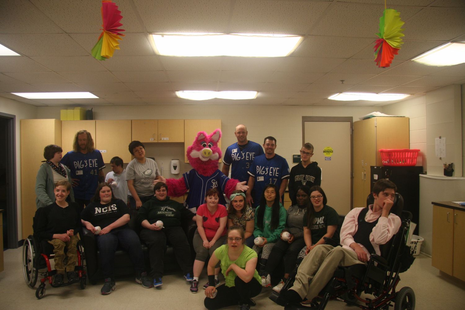 Saints players and mascot visit special education class.