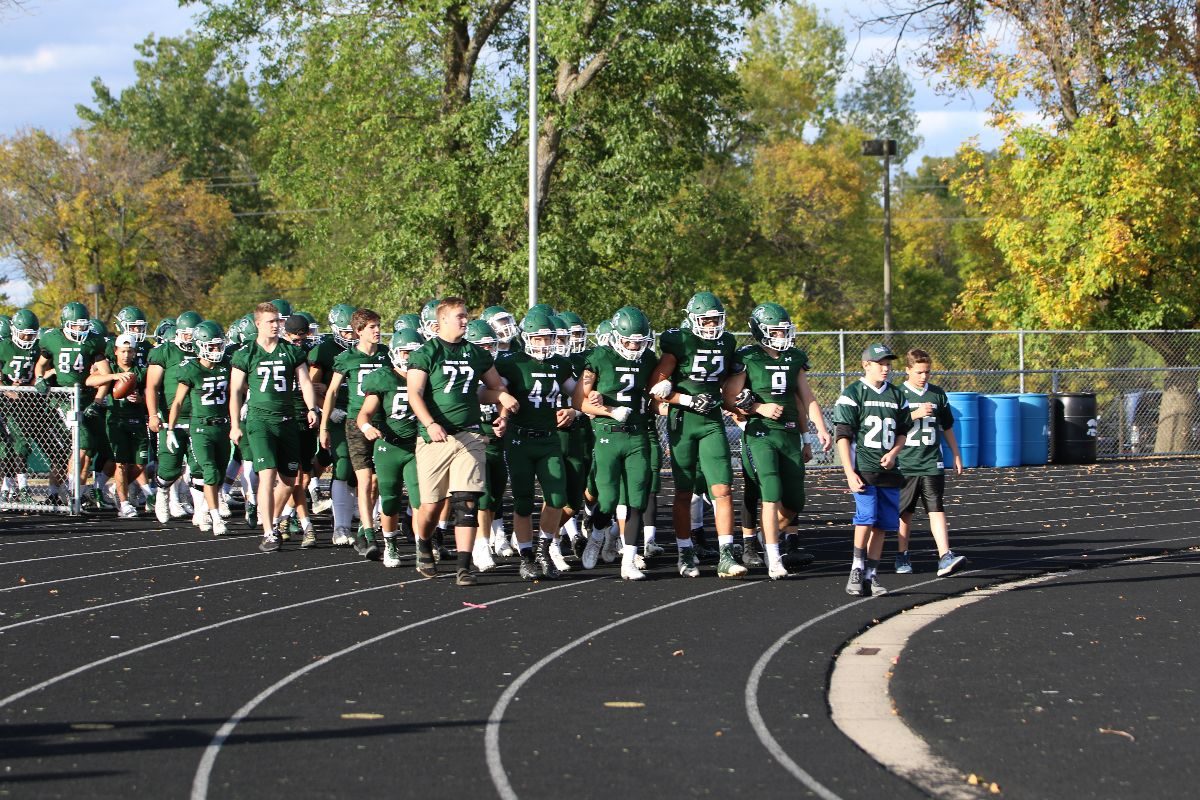 Players take the field on homecoming.