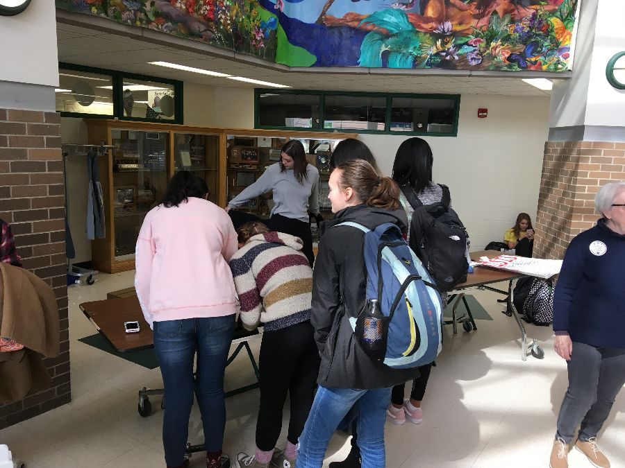 Students sign card to show support for gun control legislation