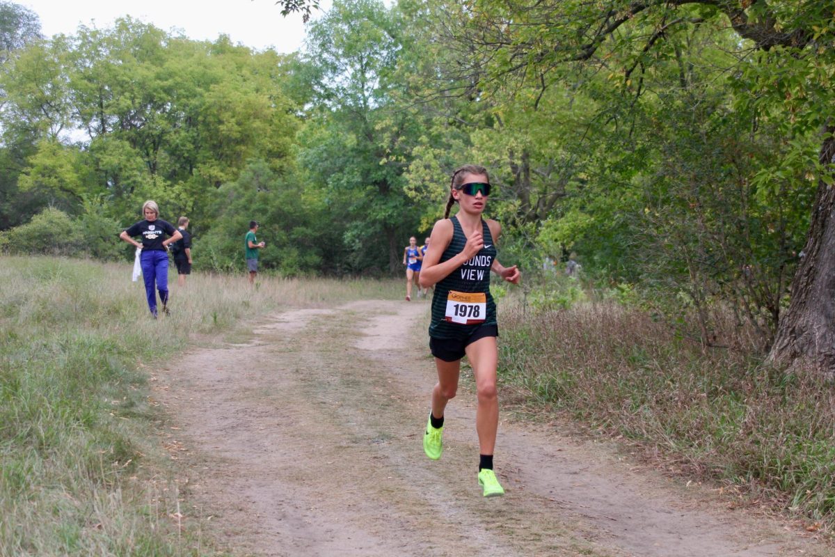 Freshman Linnea Ousdigian takes first overall at this years section meet.