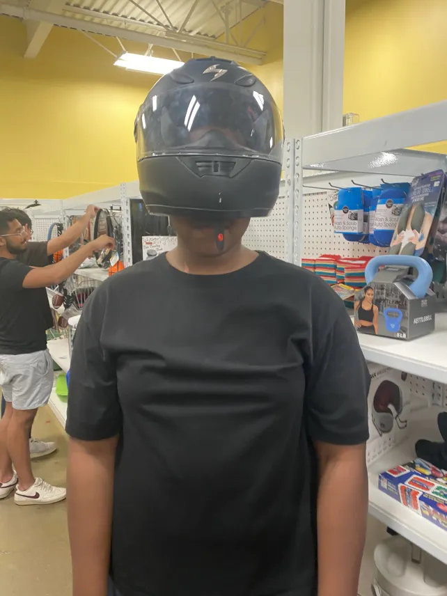 Subabe dons a helmet to avoid being recognized in public.