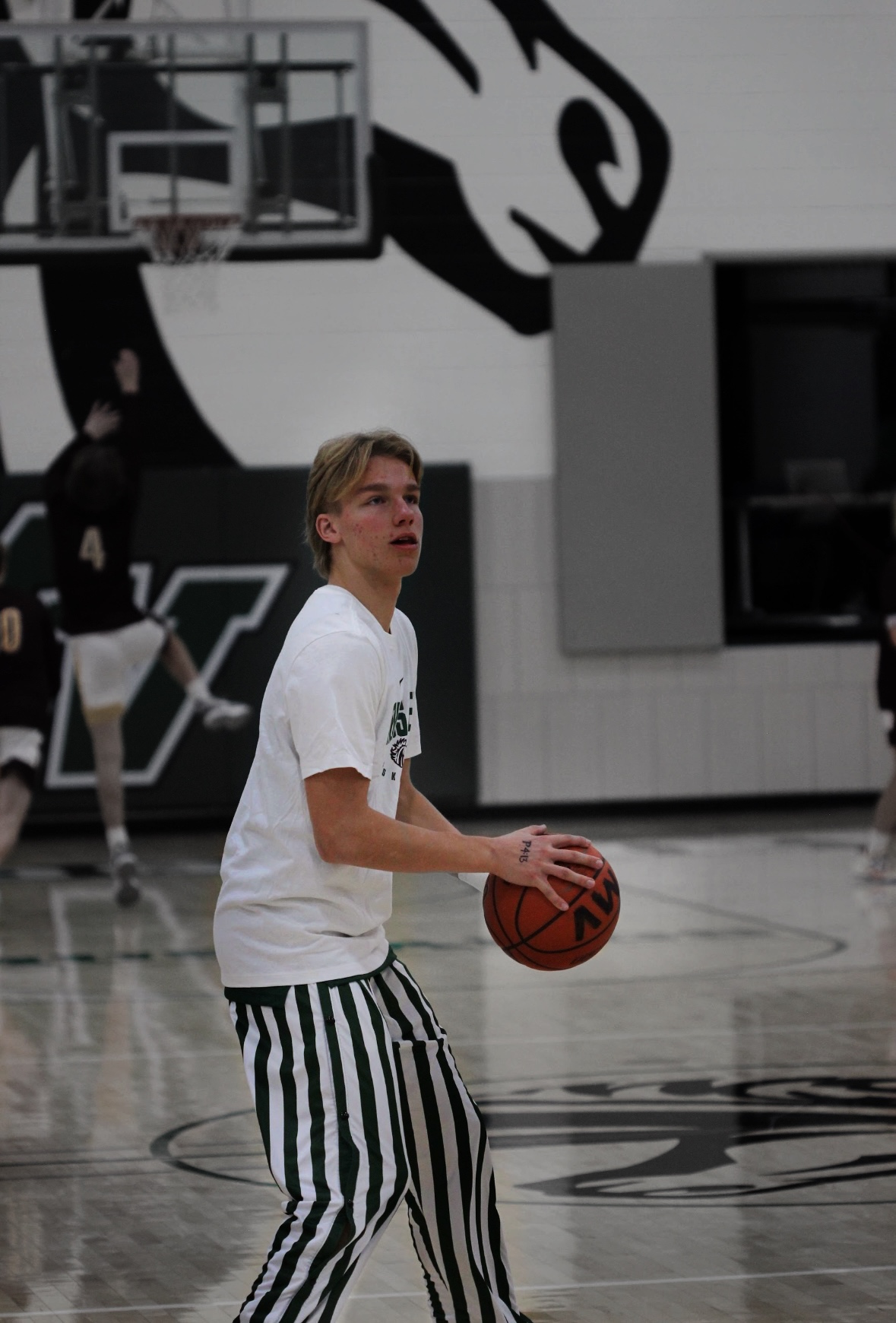 Junior Jacob Sampson warms up his shot.