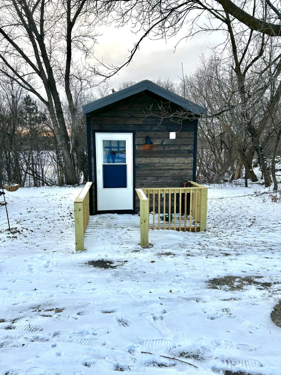 Valeries house pictured from the front. Her front door is painted a shade of dignity blue.