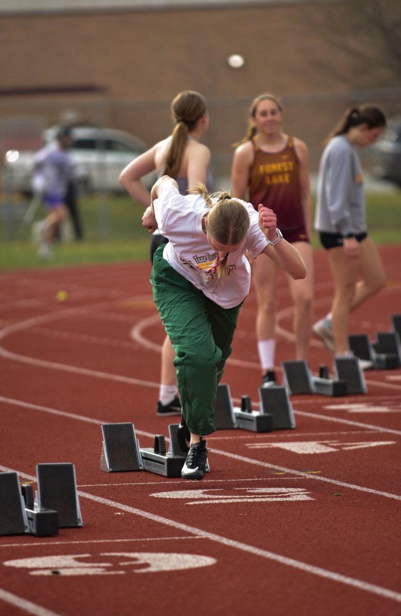 Kyra Marshall warms up her starts at the Suburban East Conference Open at Roseville High School.