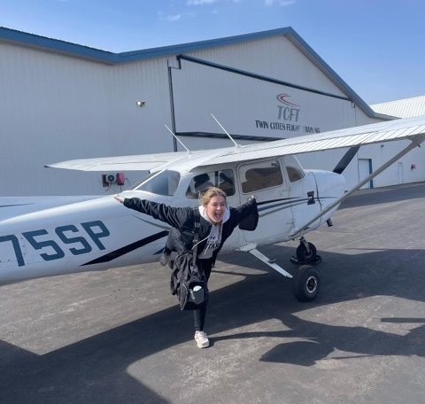 Ashbach pictured with her Cessna 172.