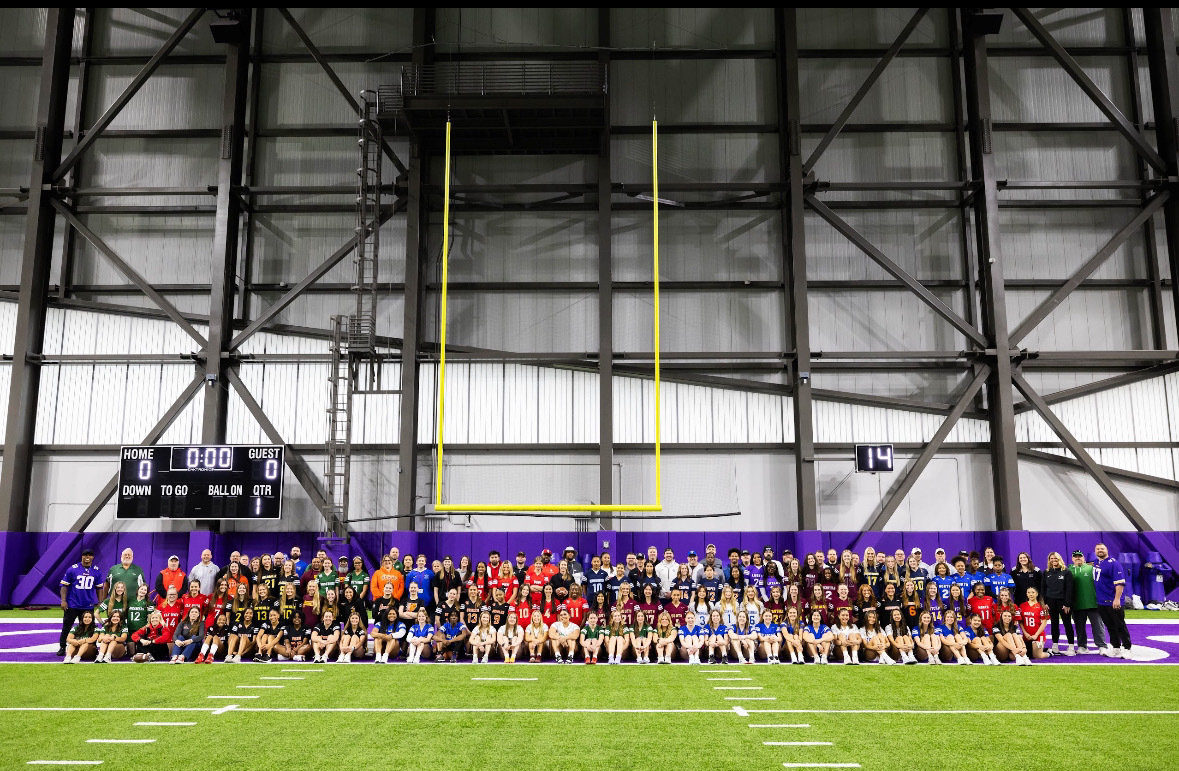 Mounds View girls flag football team at the Twin Cities Orthopedics Performance Center with the other participating schools to meet the Vikings.
