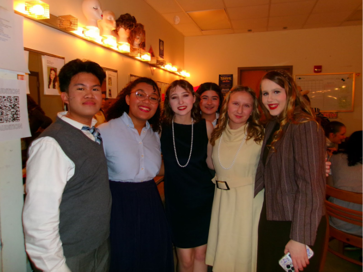 (Left to right) Junior Kent Supena. junior Satye Gahle, senior Molly Casey, freshman Scarlet Hastreiter, junior Deanna Amadick and sophomore Sophia Martineau backstage during their Nov. 9 performance.